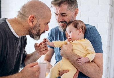 Baby Decision Confidence Workshop - two men holding baby