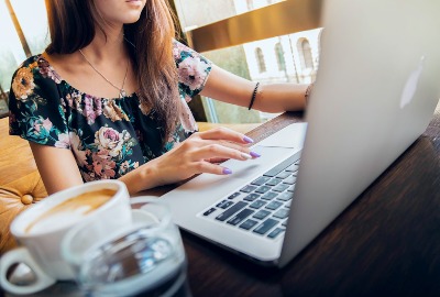 Smart Start Personal Coaching for better baby decision-making - young woman using Macbook for video call